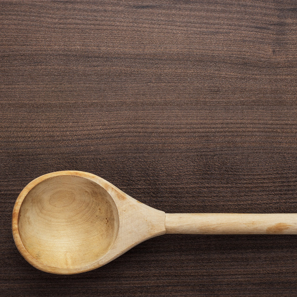 wooden spoon on the blue table - 写真・画像