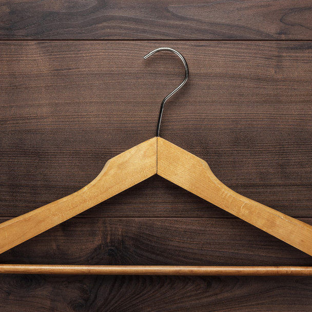 clothing hanger on brown table - Φωτογραφία, εικόνα