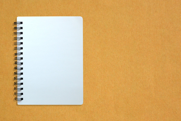 Notebook on yellow cardboard paper - Φωτογραφία, εικόνα