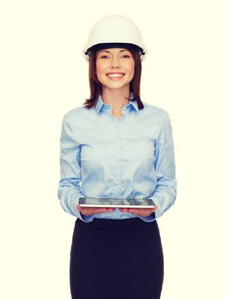 young businesswoman in white helmet with tablet pc - Foto, Bild