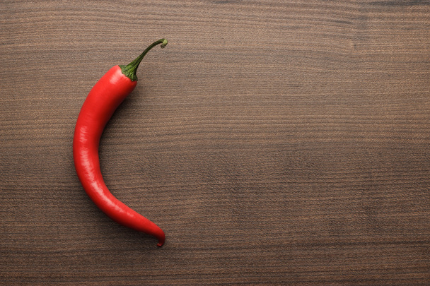 red hot chilli pepper on wooden table - Foto, Imagem