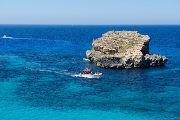 Maltese coastline with the cliffs,gold rocks over the sea in the Malta island with the blue clear sky background,Malta, popular destination Comino island in Malta,maltese nature - Photo, Image