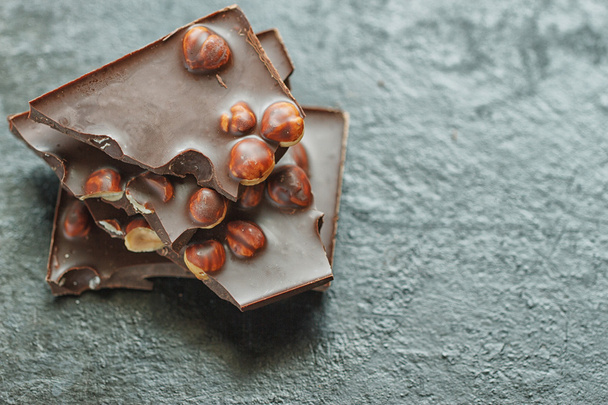 chocolate with nuts on wooden background - Foto, Imagem