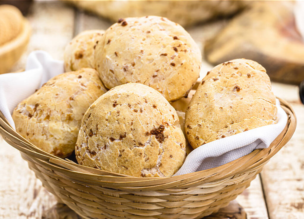 bowl full of traditional brazilian cheese bread or cheese biscuit, served crispy and hot, with coffee - Photo, image