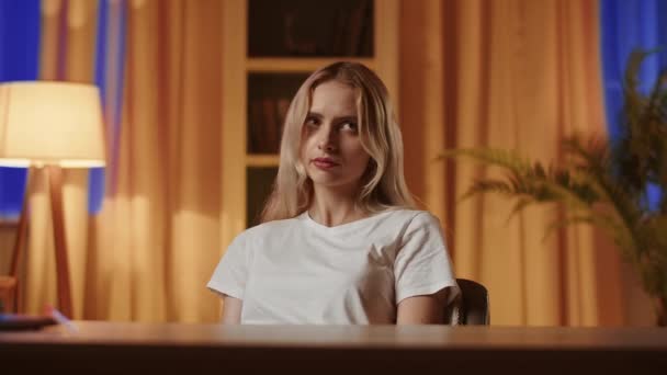 A young blonde girl uses a smartphone, plays in online casino and makes unsuccessful bet. An upset lady loses and puts the phone aside with a disappointed tired look. The gesture of closedness - Footage, Video