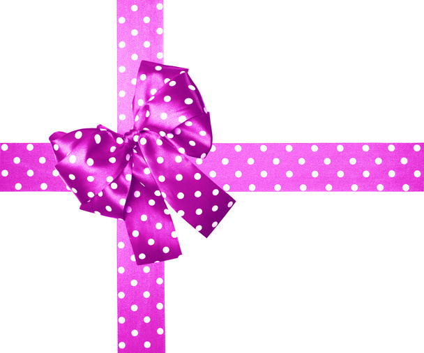 rosa Schleife und Schleife mit weißen Tupfen aus Seide - Foto, Bild