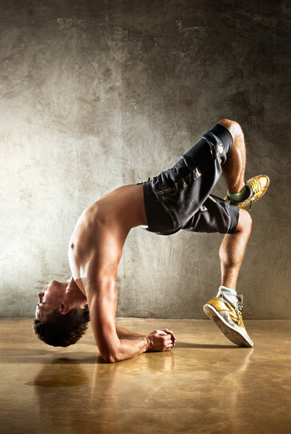 Young man sports exercises - Fotó, kép
