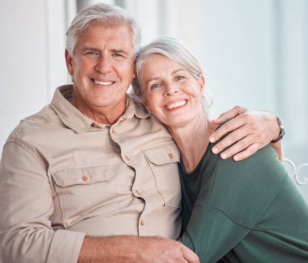 Senior couple, hug and portrait on couch with smile, care and bonding with love, retirement and home living room. Happy old man, elderly woman and embrace on lounge sofa, relax and pride in apartment. - Photo, Image