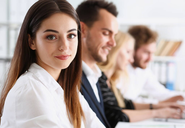 Beautiful smiling woman portrait with group of people listen carefully during seminar. Study event client conversation job customer support service case hear in court leader performance concept - Photo, Image