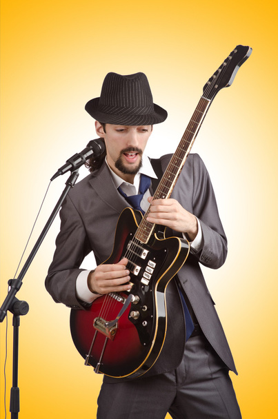 Businessman playing the guitar - Foto, imagen