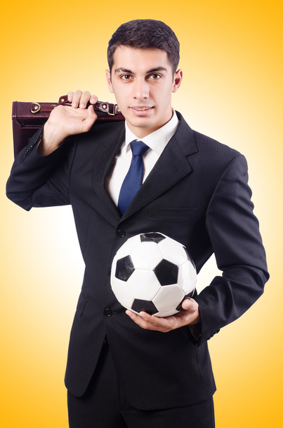 Young businessman with football - Photo, Image