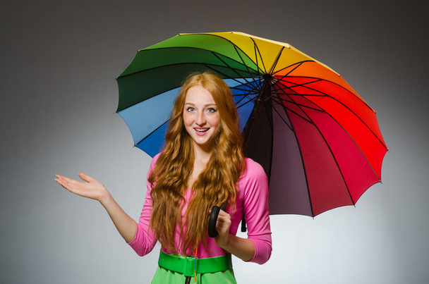 Woman holding colorful umbrella - Photo, Image