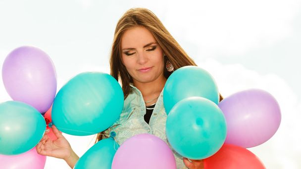 Woman holding colorful balloons - Fotografie, Obrázek