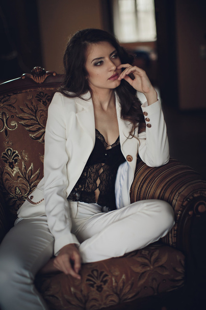 Beautiful woman in fashion white suit - Photo, Image