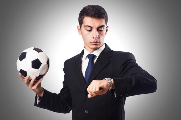 Молодой бизнесмен с мячом против градиента
 - Фото, изображение