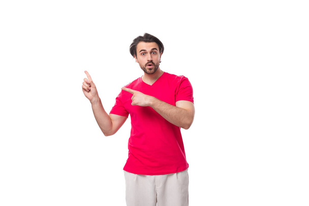 young man dressed in a red t-shirt with a mockup for an identity on a white background. - Photo, Image