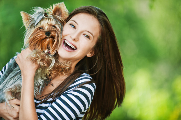 Woman beautiful young holds small dog - Photo, Image