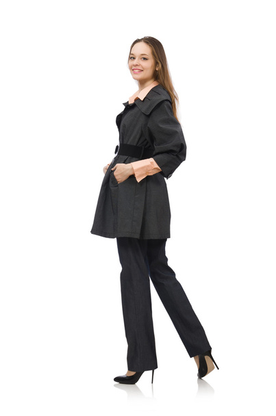 Schattig meisje in warme donkere jas geïsoleerd op wit - Foto, afbeelding
