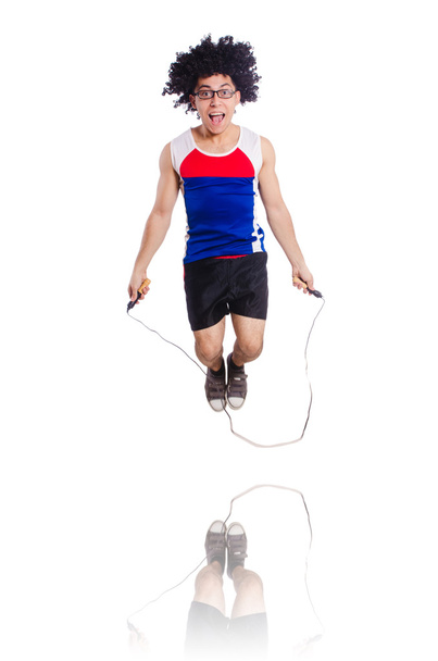 Парень прыгает с скакалкой, изолированной на белом - Фото, изображение