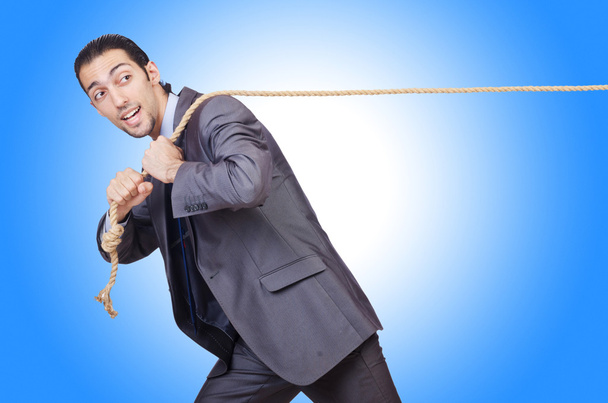 Businessman pulling rope - Photo, Image