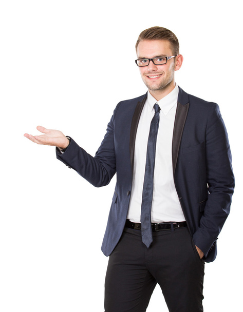Young businessman take something on his hand, concept isolated - Foto, imagen