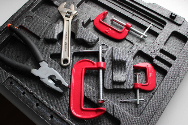 Pressure Tools Set. Engineering Equipment For Fixing And Clamping In Separate Slots Of Tool Box - Photo, Image