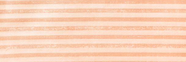 Peach fuzz striped cotton texture banner. Fabric textile background header. - Photo, Image