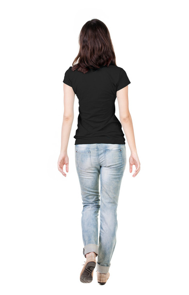 Back view of woman in jeans and t-shirt - Foto, Imagem