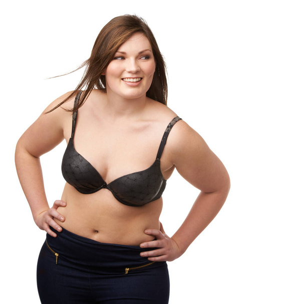 Thinking, smile and bra with a plus size woman in studio isolated on a white background for body positivity. Idea, vision and a happy young model looking natural or confident in her underwear. - Zdjęcie, obraz