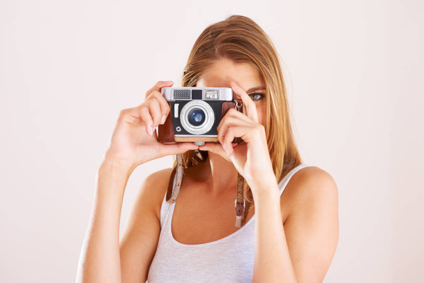 Photographer, woman and retro camera in studio for photoshoot, content creation and paparazzi magazine on white background. Portrait, journalist and photography with lens for creative art production. - Photo, Image