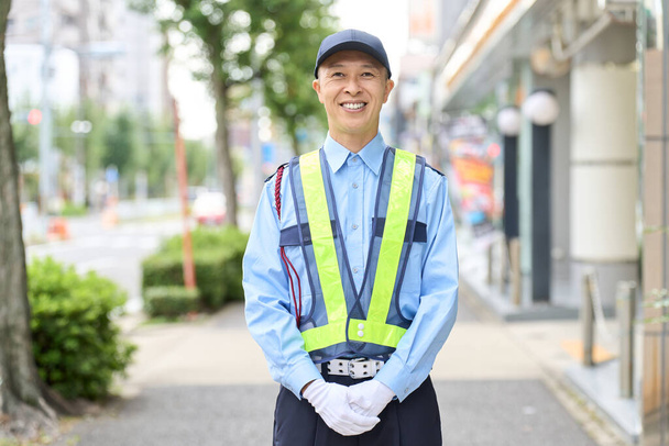 Asian man working as a security guard - Photo, Image
