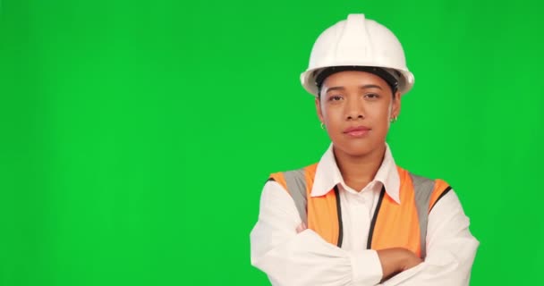 Woman in construction, face and arms crossed on green screen, confidence and agreement on studio background. Mockup space, female contractor looking at choice and architecture with presentation. - Footage, Video