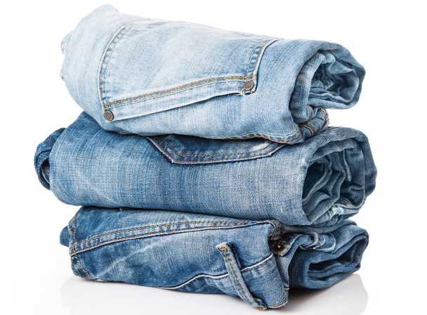 Stack of blue jeans - Фото, изображение