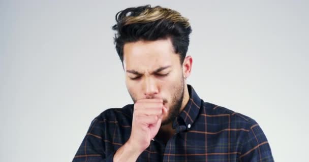 Man, cough and sick in studio or white background for flu virus, bacteria disease or isolated mockup space. Male person, cold pandemic and fever or medical asthma problem, allergy or wellness fail. - Footage, Video