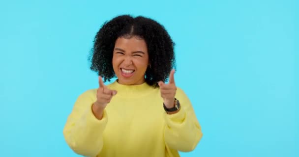 Woman, applause and excited about win, happiness and celebration with support isolated on blue background. Happy female person, cheers and yes, thumbs up and agreement, achievement and mockup space. - Footage, Video