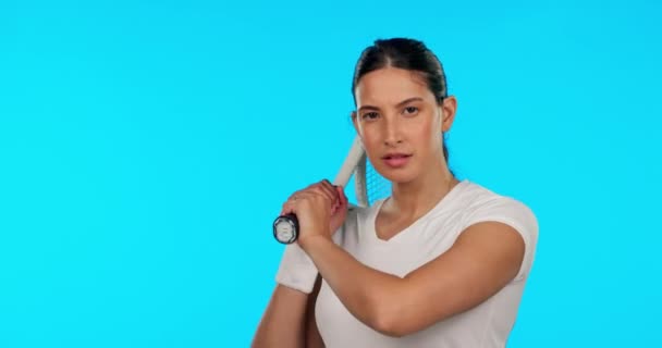 Face, tennis and confident woman with racket in studio isolated on a blue background mockup. Portrait, racquet sports or serious female athlete from Brazil ready to start exercise, workout or fitness. - Footage, Video
