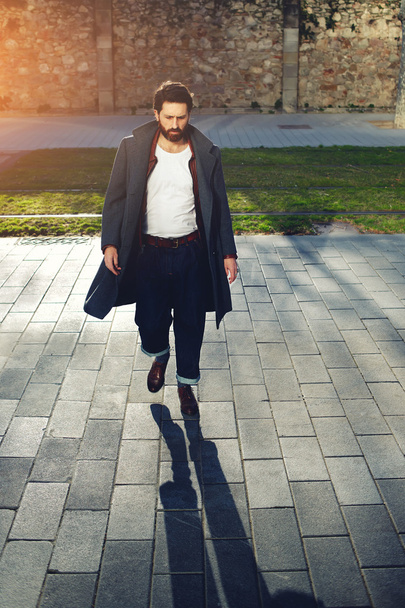 Fashionable adult man dressed in coat - Фото, изображение