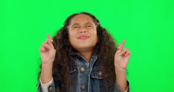 Hope, girl and excited with green screen and fingers crossed feeling happy with youth. Funny, smile and young child with good luck and emoji hand sign for crazy wish and kids dream of children. - Footage, Video
