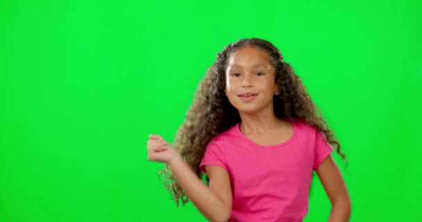 Girl child, green screen and face with dancing, moving or steps for music, happy or freedom in mock up. Young female kid, dancer or excited for comic playing in mockup space for childhood development. - Footage, Video