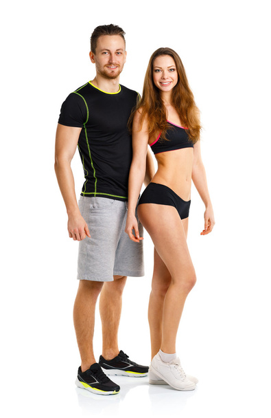 Sport couple - man and woman after fitness exercise on the white - Foto, Imagen