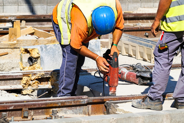 Man is working at the railway conctruction - Photo, Image