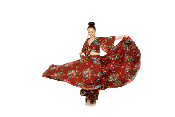 Young beautiful woman dancing gypsy dance - Fotografie, Obrázek