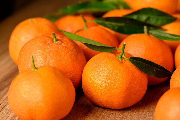 fresh juicy tangerines on a wooden table 2 - Photo, Image