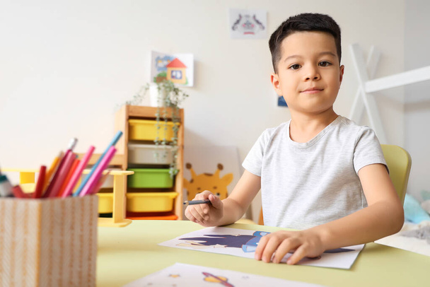 Little Asian boy drawing at home - Foto, Imagem