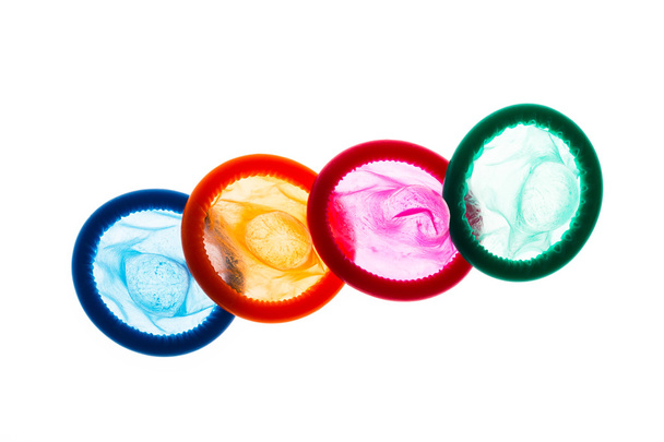 Красочные презервативы на белом
 - Фото, изображение