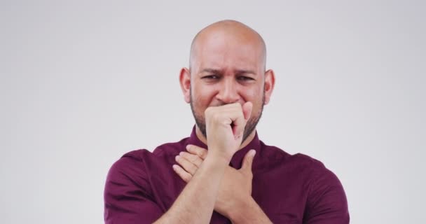 Sick, coughing and face of man in studio with medical emergency, virus or respiratory disease. Illness, allergies and portrait of male person with a flu, cold or chest infection by a white background. - Footage, Video