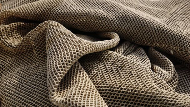 Waved fishing net fabric stacked as a background - Photo, Image