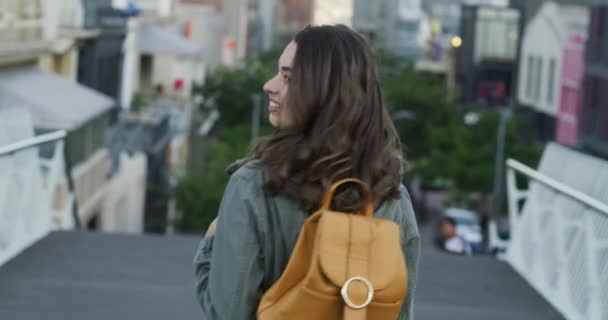 Travel, camera and woman in a city, picture and tourism with a smile, excited and travelling with a backpack. Portrait, female person and tourist in the street, adventure and photograph on a vacation. - Filmagem, Vídeo