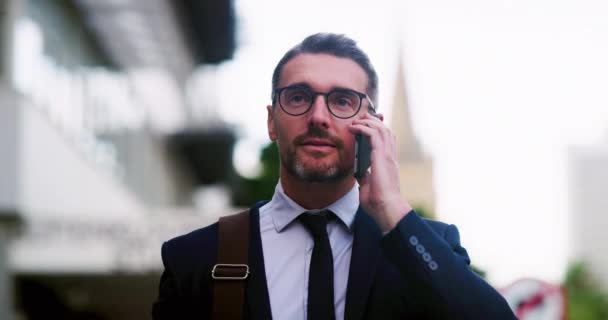 Business, CEO man and phone call communication in city for conversation, mobile networking and discussion. Mature executive talking on smartphone in town for contact, hello and cellphone connection. - Footage, Video