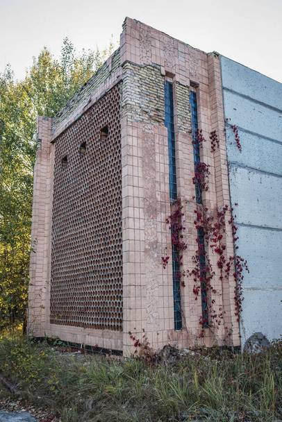One of the buildings of Jupiter factory in Pripyat ghost city in Chernobyl Exclusion Zone in Ukraine - Photo, Image